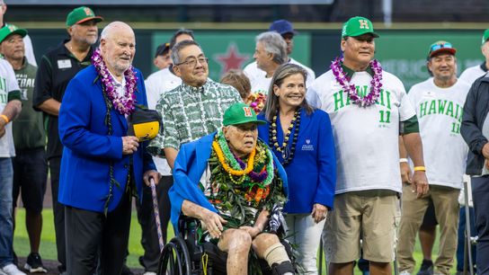 Former Wichita State head coach Gene Stephenson (left) and Hawai’i left-handed pitcher Derek Tatsuno (right) presented coach Les Murakami with his blue blazer. Former Wichita State head coach Gene Stephenson (left) and Hawai’i left-handed pitcher Derek Tatsuno (right) presented coach Les Murakami with his blue blazer.