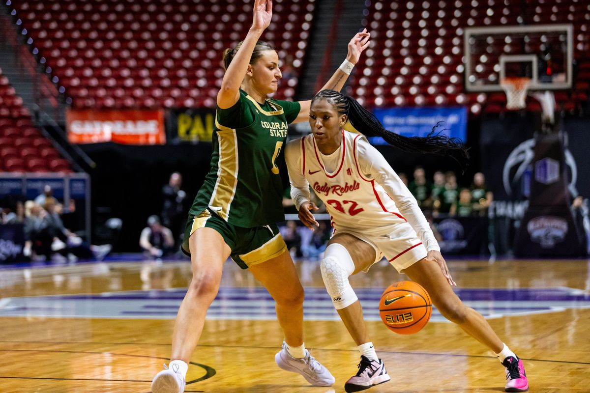 UNLV Lady Rebels forward Meadow Rowland (32) dribbles the ball towards the basket during a Mountain West Tournament semifinal game between UNLV Lady Rebels and the Colorado State Rams, Monday March 9, 2026 in Las Vegas, Nev.