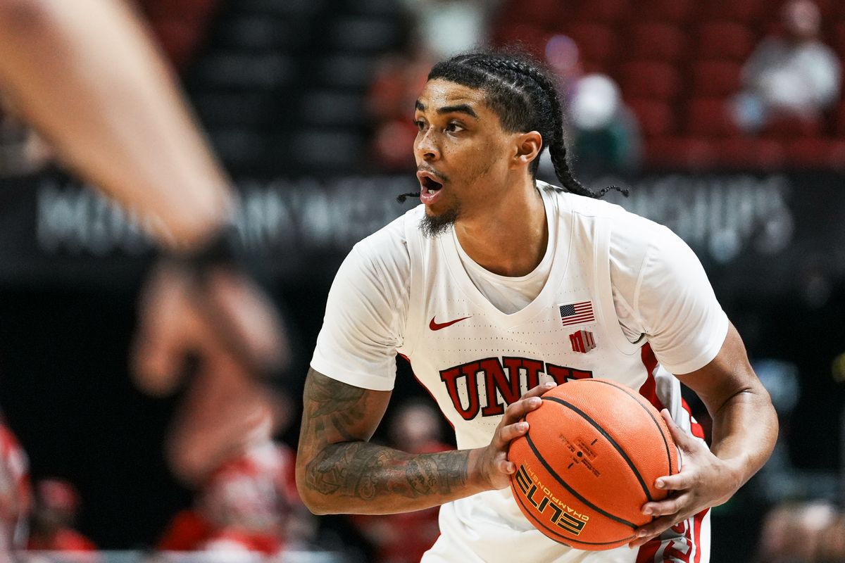 UNLV Runnin’ Rebels guard Howie Fleming (3) scans the court during the first round of a Mountain West Championship tournament game between the UNLV Runnin’ Rebels and the Wyoming Cowboys, Wednesday March 11, 2026 in Las Vegas, Nev.