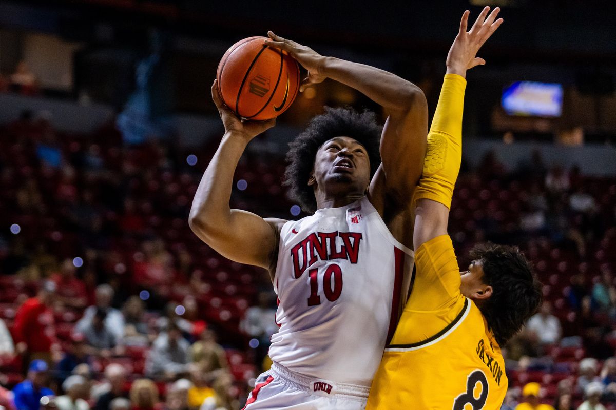 UNLV Runnin’ Rebels forward Jacob Bannarbie (10) goes for a contested lay-up during the first round of a Mountain West Championship tournament game between the UNLV Runnin’ Rebels and the Wyoming Cowboys, Wednesday March 11, 2026 in Las Vegas, Nev.