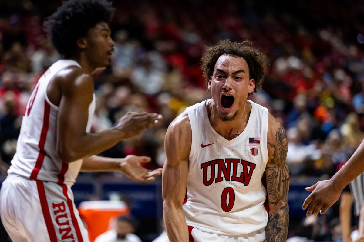 UNLV Runnin’ Rebels guard Dra Gibbs-Longhorn (0) yells in celebration after a Rebels’ and-one basket during the first round of a Mountain West Championship tournament game between the UNLV Runnin’ Rebels and the Wyoming Cowboys, Wednesday March 11, 2026 in Las Vegas, Nev.