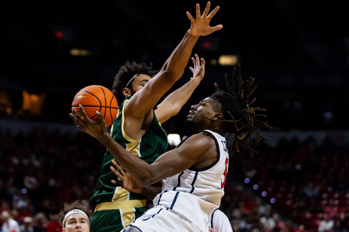 San Diego Aztecs forward Pharaoh Compton (5) goes for a contested lay-up during a Mountain West Championship tournament quarterfinal game between the San Diego Aztecs and the Colorado State Rams, Thursday March 12, 2026 in Las Vegas, Nev.