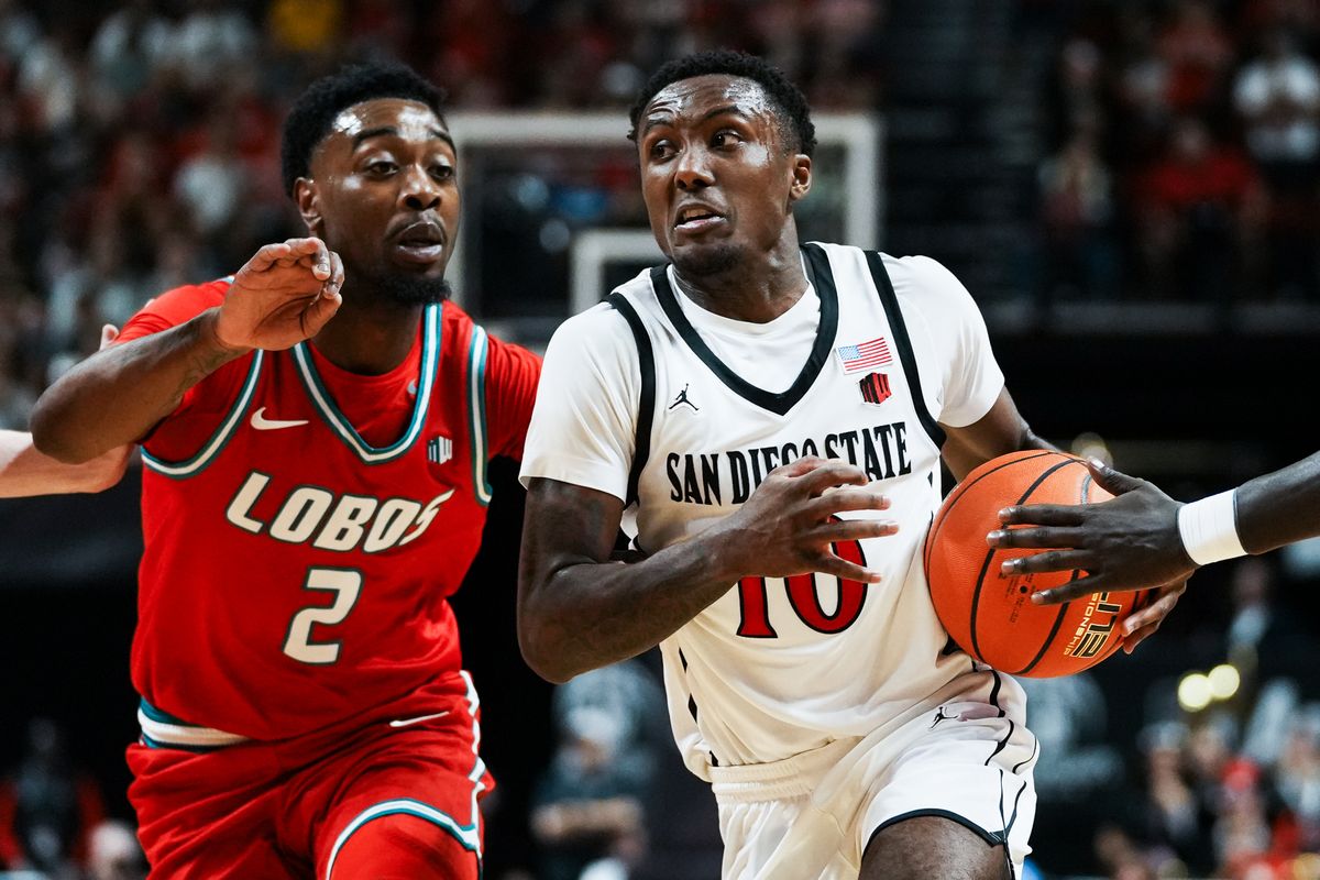 San Diego State BJ Davis (10) takes the ball down the court while guarded by New Mexico Tajavis Miller (2) during  semifinal Mountain West Championship tournament game between San Diego State and New Mexico on Friday March 13, 2026 in Las Vegas, Nev.