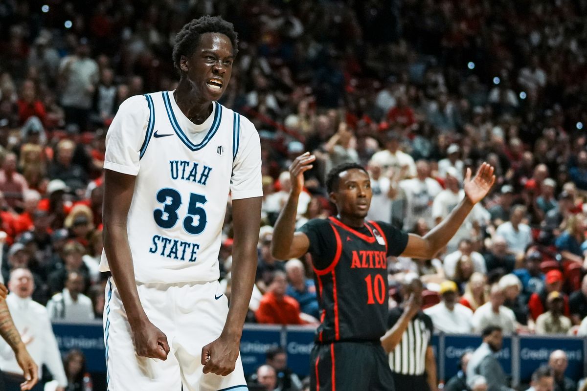 Utah State Adlan Elamin (35) celebrates a call from an official while San Diego State BJ Davis reacts in the background during final Mountain West Championship tournament game between San Diego State and Utah State on Saturday March 14 2026 in Las Vegas, Nev.