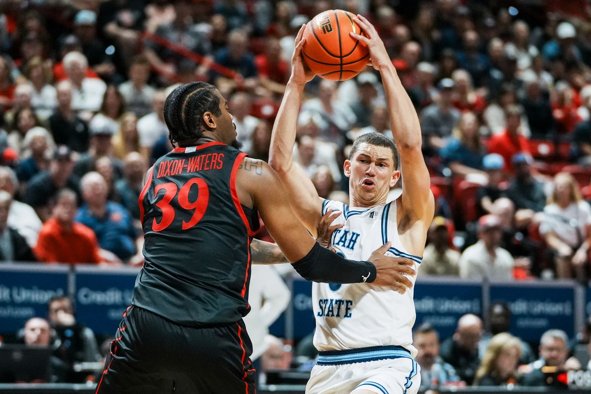 San Diego State guard Reese Dixon-Waters (39) guards Utah State Drake Allen (8) during final Mountain West Championship tournament game between San Diego State and Utah State on Saturday March 14, 2026 in Las Vegas, Nev.