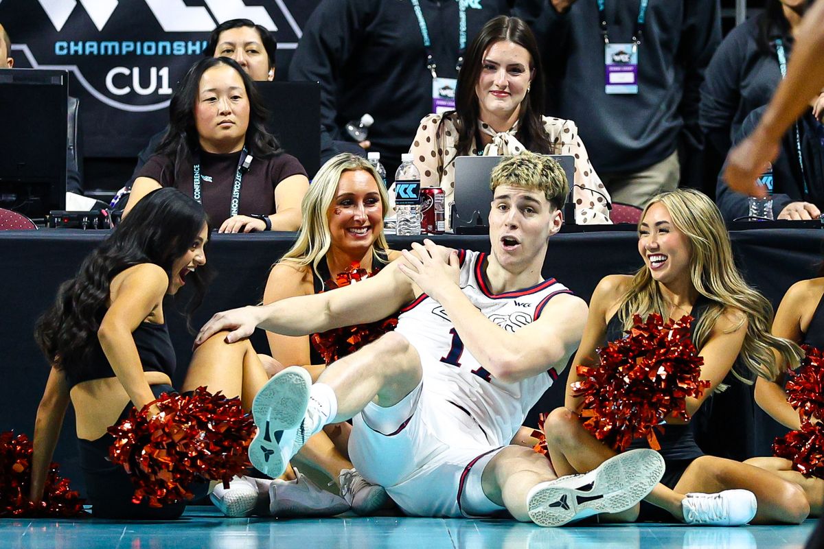 Gonzaga Bulldogs G Mario Saint-Supéry (17) falls into the Oregon State Beavers cheerleaders after making a basket during the 2026 WCC Tournament Semi-Finals against the Oregon State Beavers on Monday March 9, 2026, in Las Vegas, Nevada. 