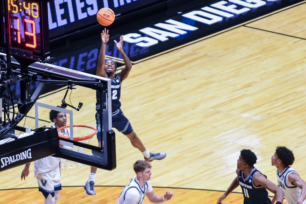 Utah State guard MJ Collins (2) takes a shot during an NCCA March Madness game against Villanova Friday March 20, 2026 in San Diego , California. Utah State guard MJ Collins (2) takes a shot during an NCCA March Madness game against Villanova Friday March 20, 2026 in San Diego , California.