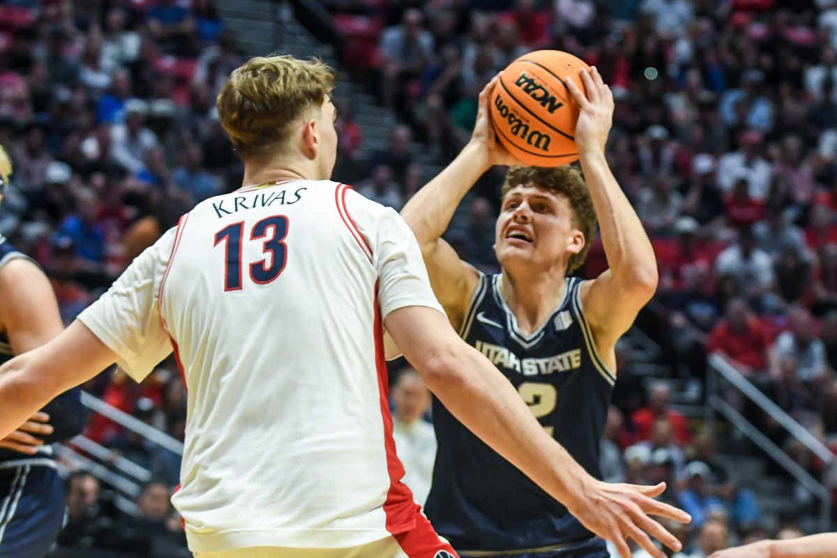 Utah State guard Mason Falslev (12) looks to shoot during an NCAA East Region second round game against Arizona Sunday March 22, 2026 in San Diego, California. Utah State guard Mason Falslev (12) looks to shoot during an NCAA East Region second round game against Arizona Sunday March 22, 2026 in San Diego, California.