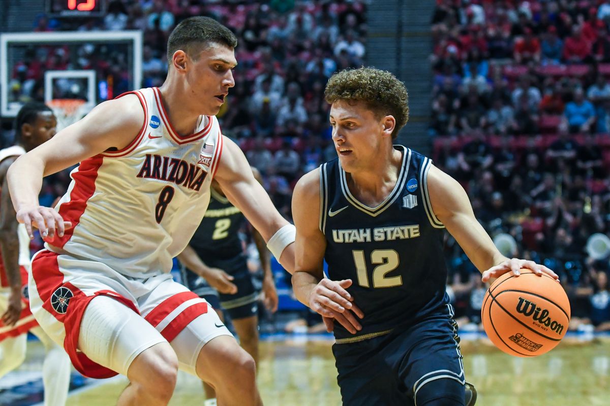 Utah State guard Mason Falslev (12) dribbles the ball during an NCAA East Region second round game against Arizona Sunday March 22, 2026 in San Diego, California. Utah State guard Mason Falslev (12) dribbles the ball during an NCAA East Region second round game against Arizona Sunday March 22, 2026 in San Diego, California.