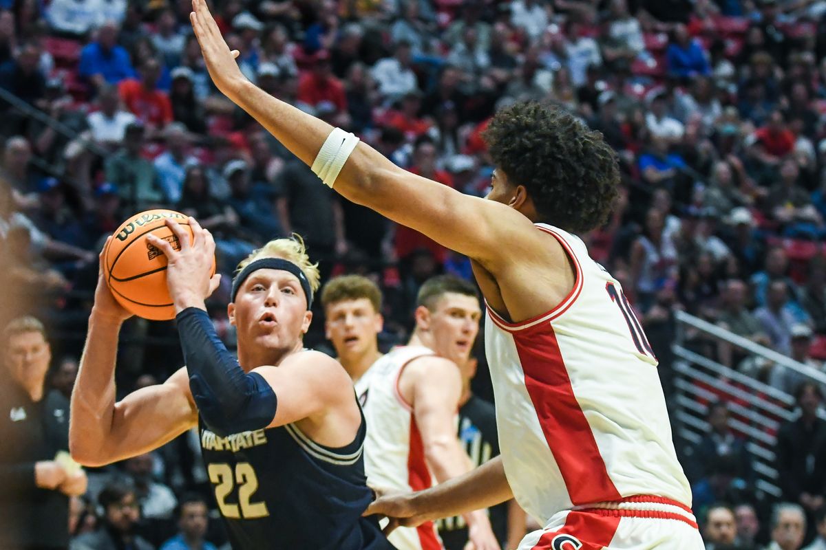 Utah State forward Karson Templin (22) looks to shoot during an NCAA East Region second round game against Arizona Sunday March 22, 2026 in San Diego, California. Utah State forward Karson Templin (22) looks to shoot during an NCAA East Region second round game against Arizona Sunday March 22, 2026 in San Diego, California.
