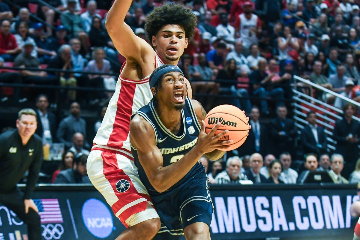 Utah State guard MJ Collins Jr. (2) drives to the basket during an NCAA East Region second round game against ArizonaSunday March 22, 2026 in San Diego, California. Utah State guard MJ Collins Jr. (2) drives to the basket during an NCAA East Region second round game against ArizonaSunday March 22, 2026 in San Diego, California.