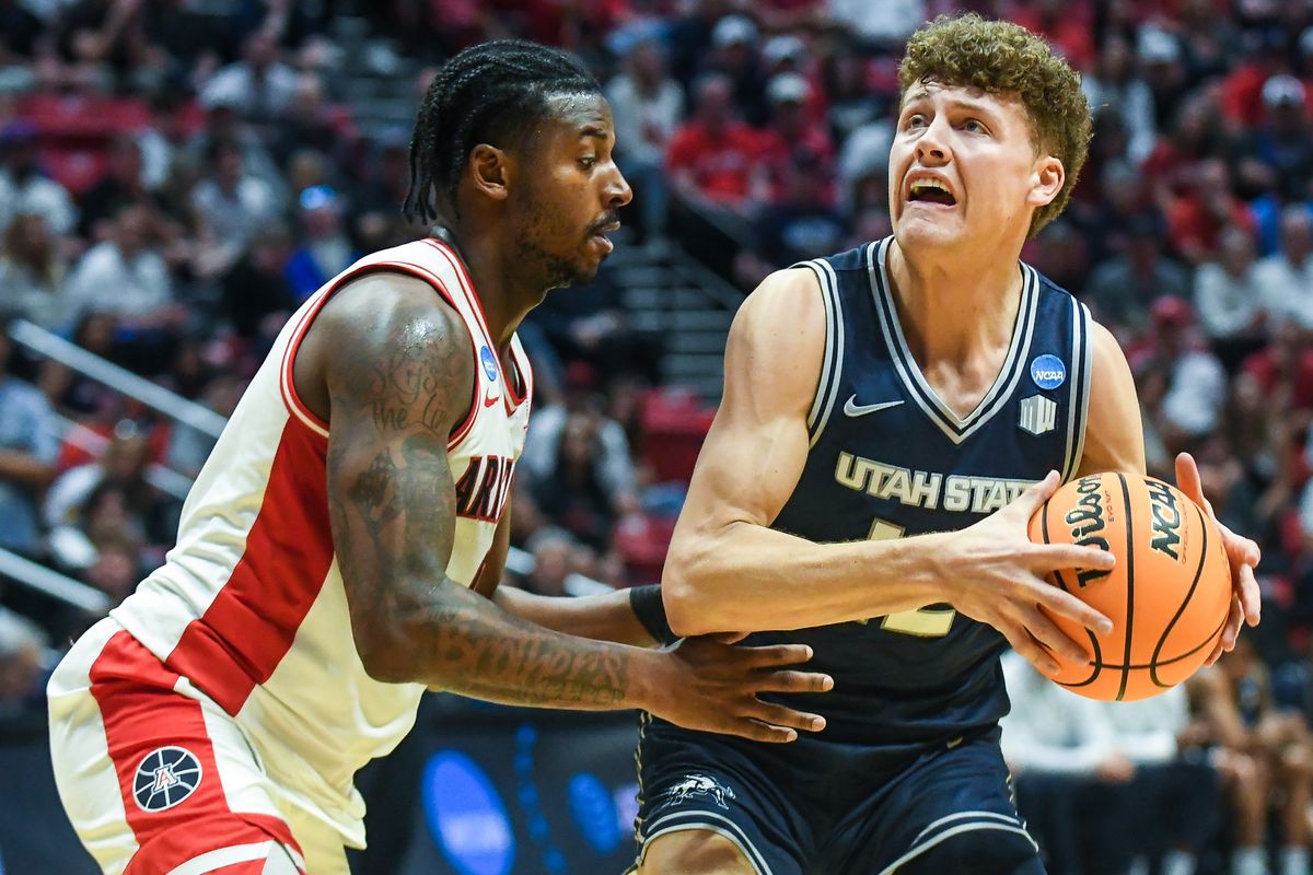 Utah State guard Mason Falslev (12) looks to shoot during an NCAA East Region second round game against Arizona Sunday March 22, 2026 in San Diego, California. Utah State guard Mason Falslev (12) looks to shoot during an NCAA East Region second round game against Arizona Sunday March 22, 2026 in San Diego, California.