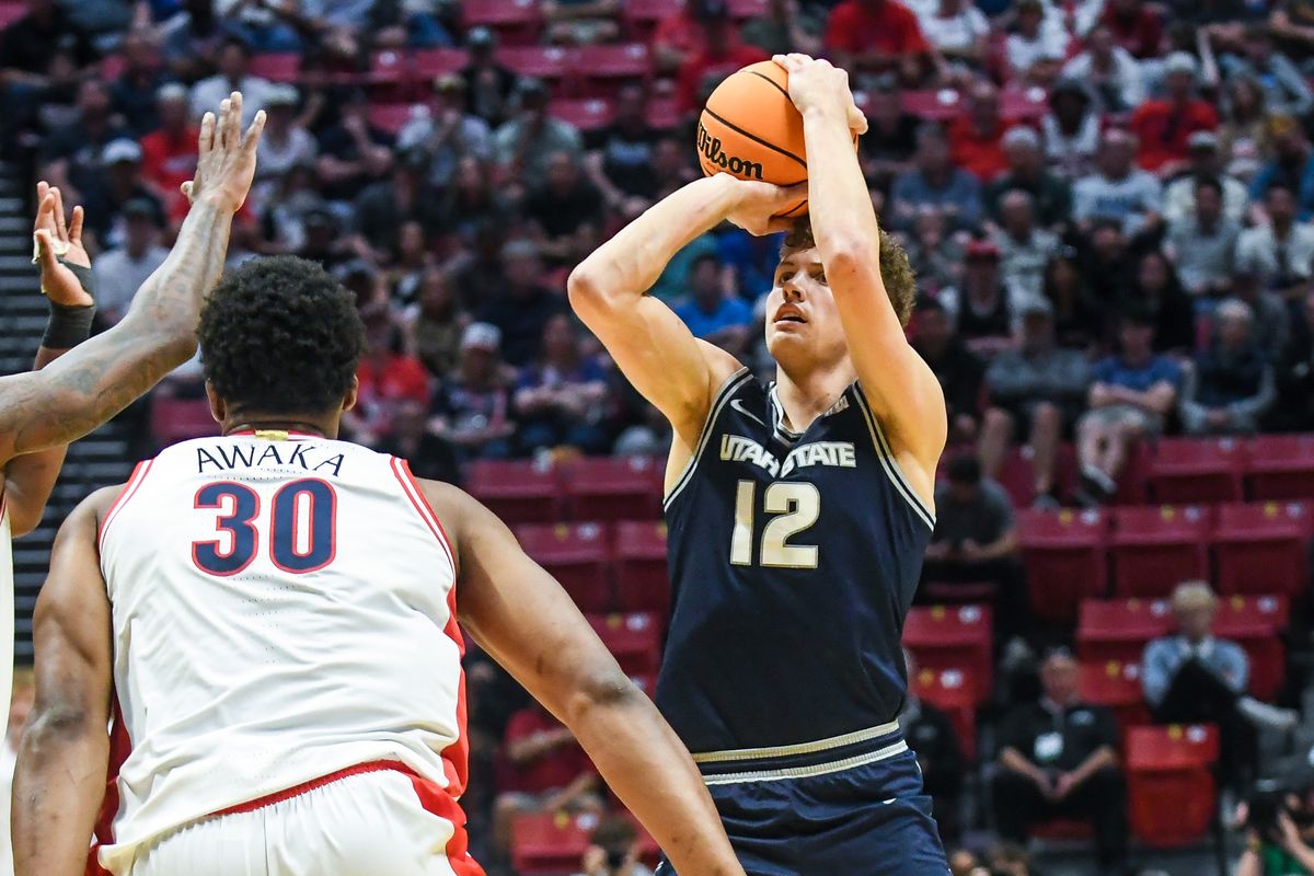 Utah State guard Mason Falslev (12) shoots the ball during an NCAA East Region second round game against Arizona Sunday March 22, 2026 in San Diego, California. Utah State guard Mason Falslev (12) shoots the ball during an NCAA East Region second round game against Arizona Sunday March 22, 2026 in San Diego, California.