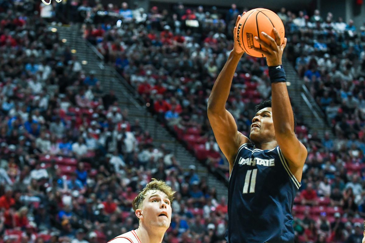 Utah State forward Garry Clark (11) catches a pass during an NCAA East Region second round game against Arizona Sunday March 22, 2026 in San Diego, California. Utah State forward Garry Clark (11) catches a pass during an NCAA East Region second round game against Arizona Sunday March 22, 2026 in San Diego, California.