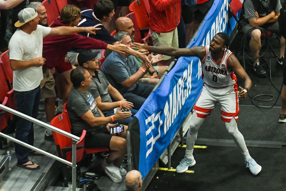 Arizona guard Jaden Bradley (0) celebrates making a basket with the fans during an NCAA East Region second round game against Utah State Sunday March 22, 2026 in San Diego, California. Arizona guard Jaden Bradley (0) celebrates making a basket with the fans during an NCAA East Region second round game against Utah State Sunday March 22, 2026 in San Diego, California.