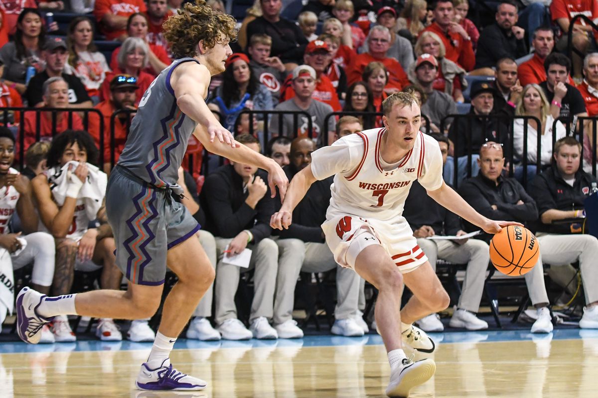 Wisconsin guard Andrew Rohde (7)  handles the basketball during an NCAA basketball  game against TCU, Friday November 28, 2025 in  San Diego, California.
