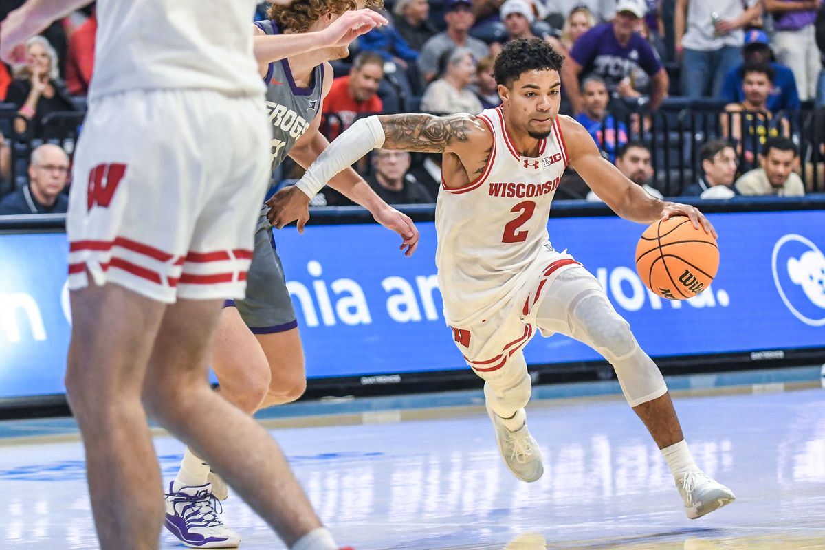 Wisconsin guard Nick Boyd (2) drives to the basket during an NCAA basketball  game against Wisconsin, Friday November 28, 2025 in  San Diego, California.