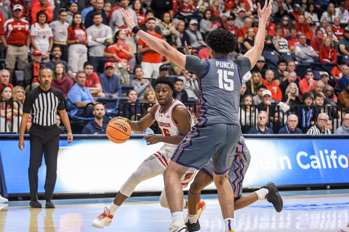 Wisconsin guard John Blackwell (25) drives to the  basket during an NCAA basketball  game against TCU, Friday November 28, 2025 in  San Diego, California.