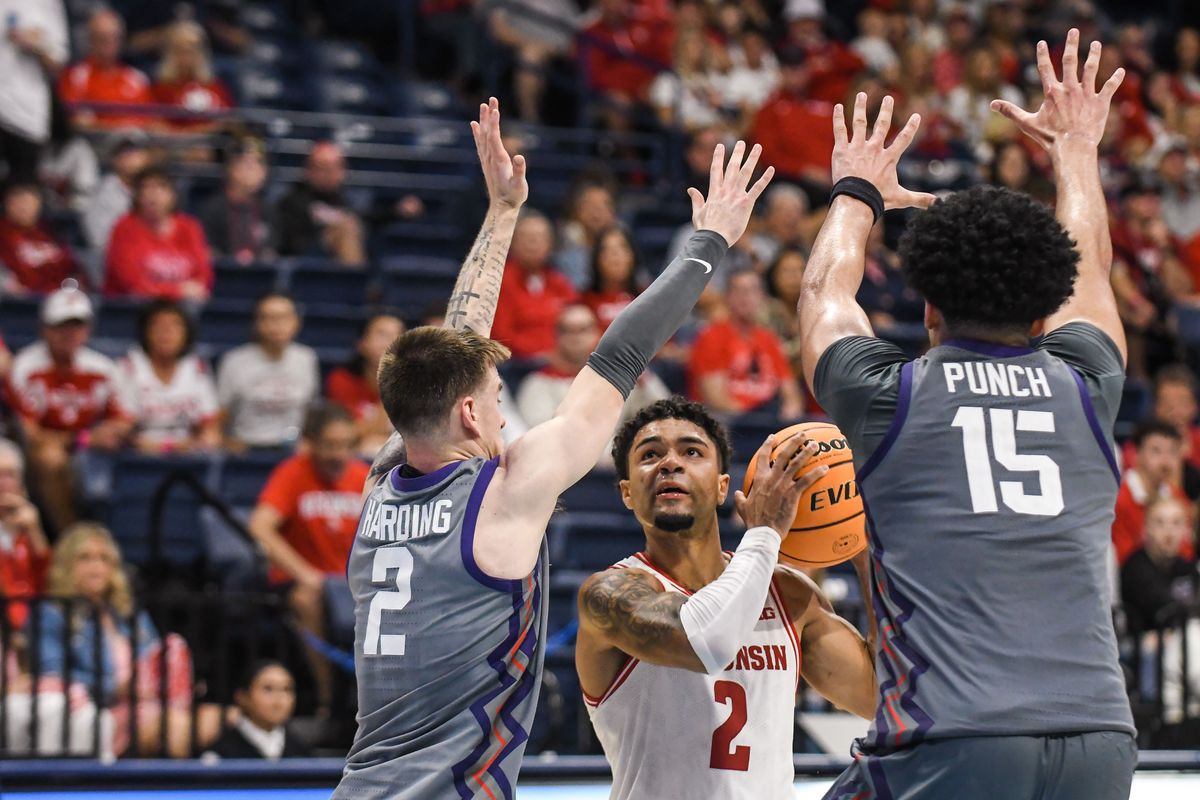 Wisconsin guard Nick Boyd (2) looks to shoot against the double team defense of TCU guard Brock Harding (2) and TCU forward David Punch (15)  during an NCAA basketball  game against TCU, Friday November 28, 2025 in  San Diego, California.