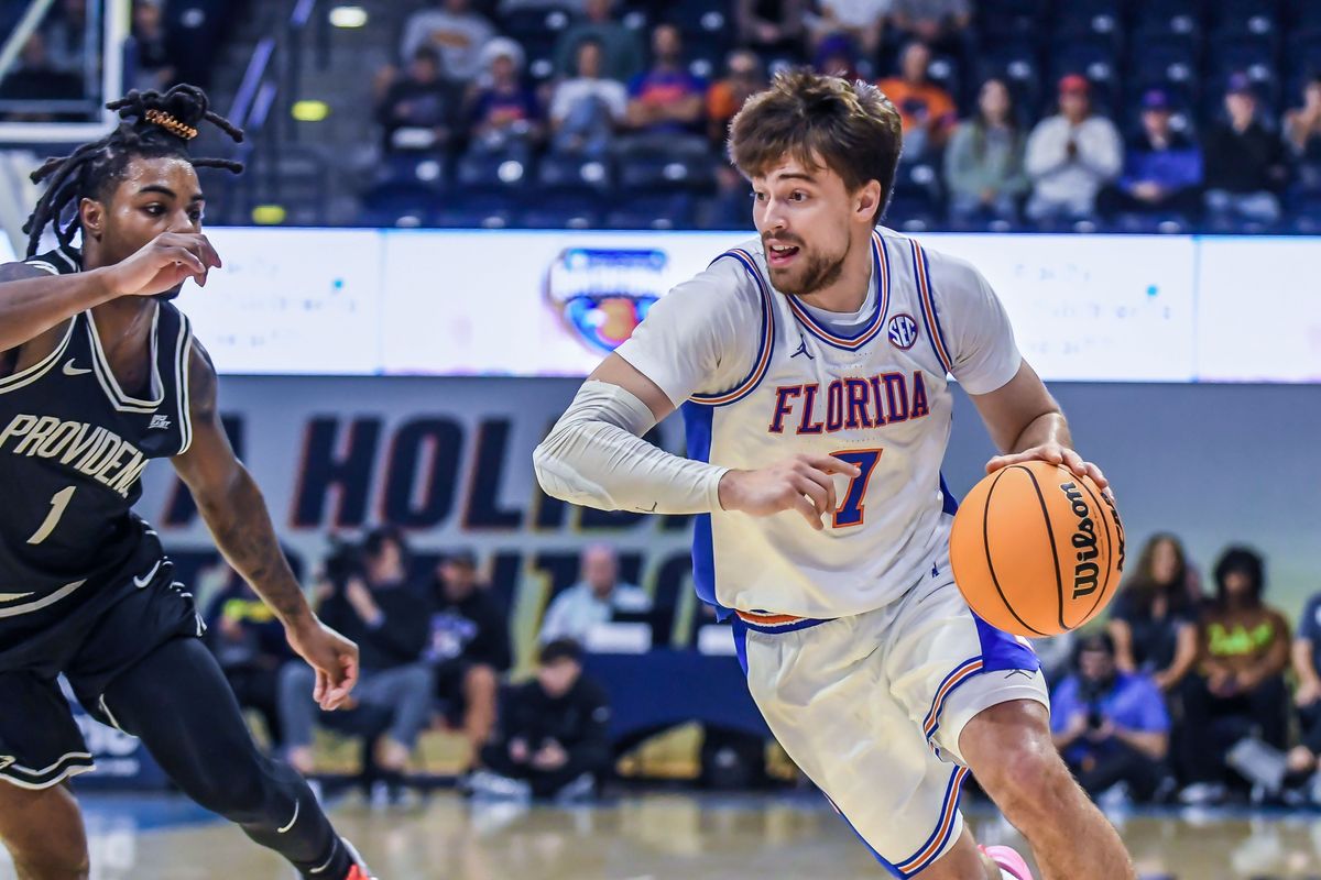 Florida guard Urban Klavzar (7) handles the basketball during an NCAA basketball  game against Providence Friday November 28, 2025 in  San Diego, California.