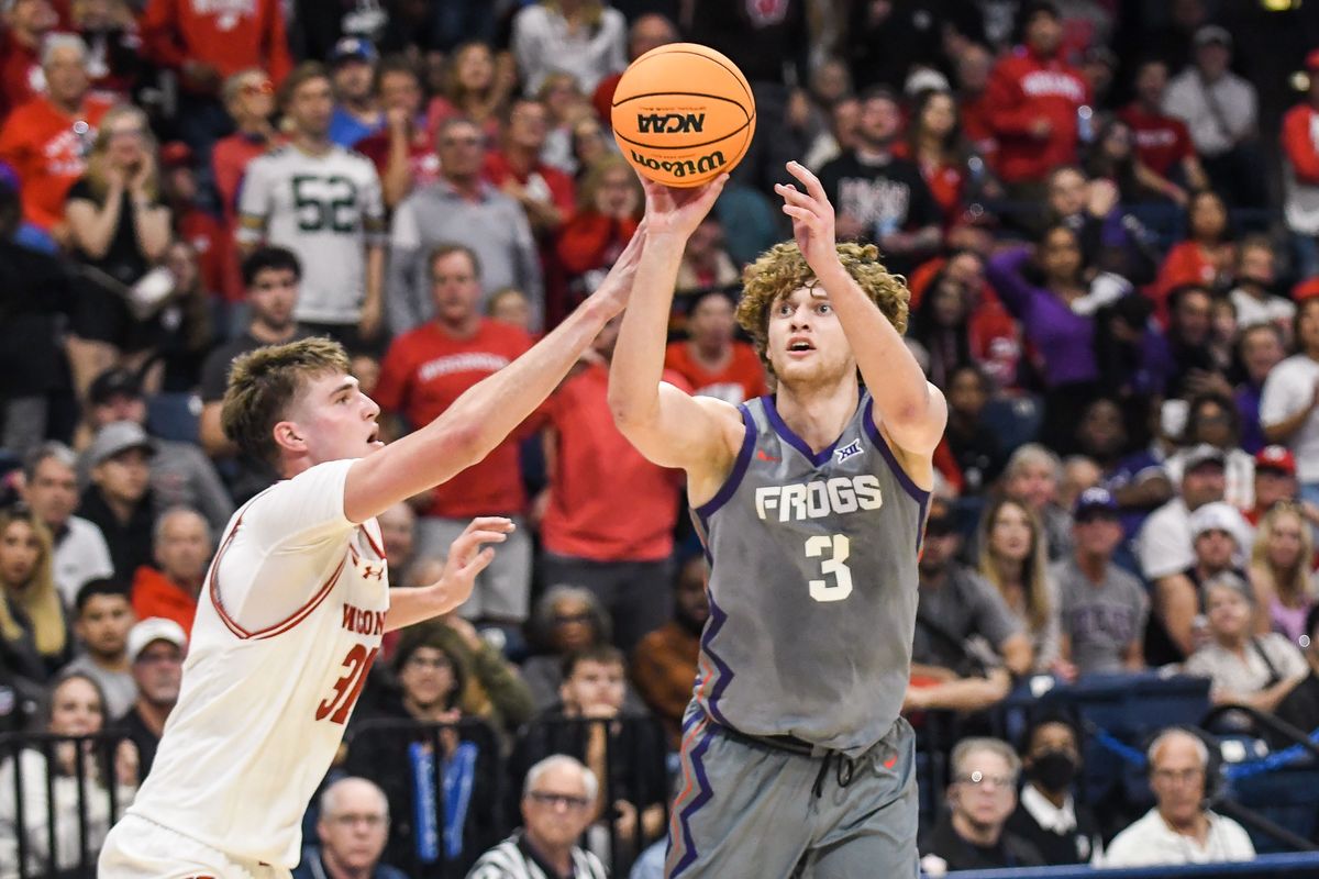 TCU guard Liutauras Lelevicius (3) takes a shot over Wisconsin forward Nolan Winter (31) during an NCAA basketball  game against Wisconsin,Friday November 28, 2025 in  San Diego, California.