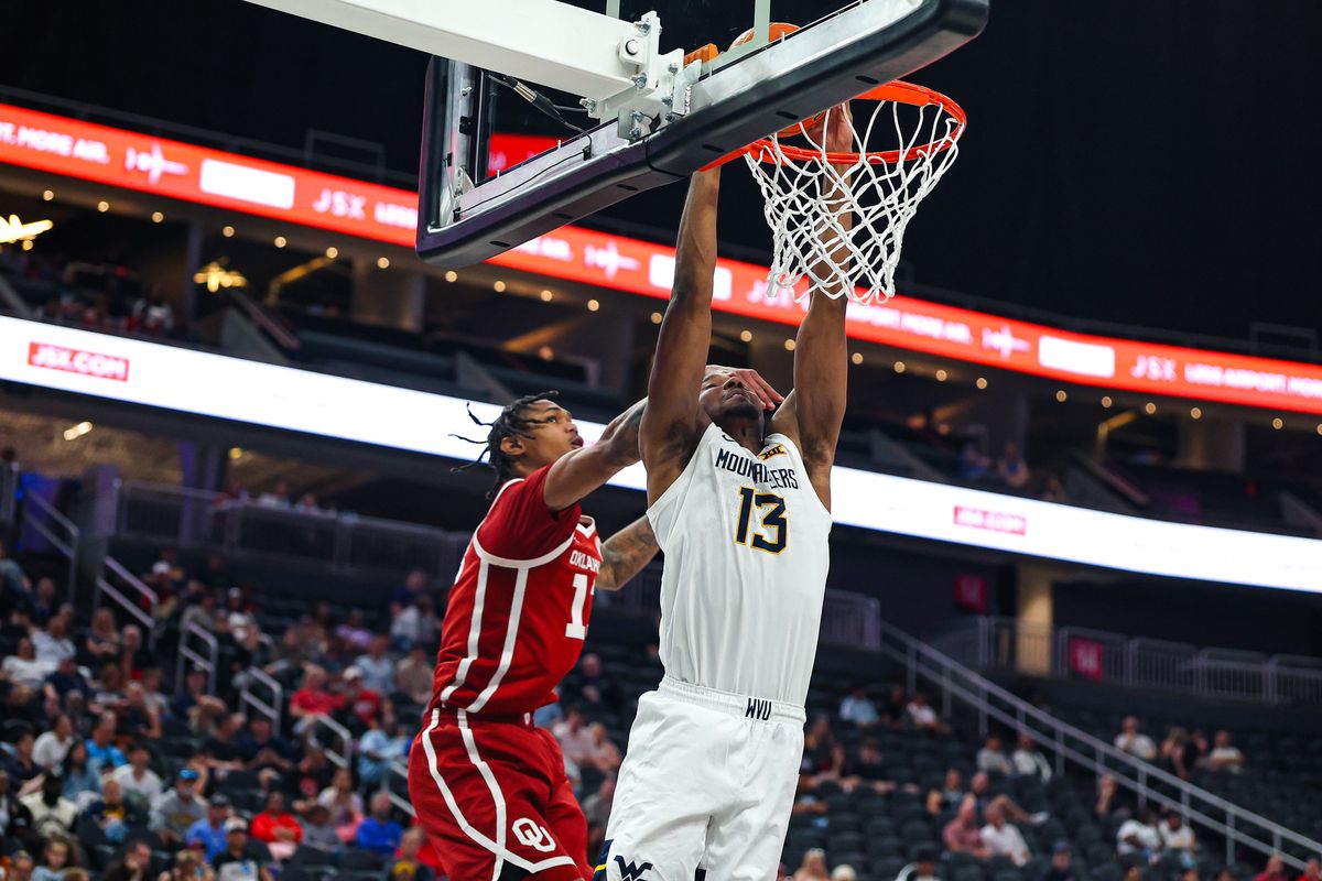 West Virginia Mountaineers G Chance Moore (13) dunks the ball while being hit in the face during the 2026 College Basketball Crown Championship against the Oklahoma Sooners on Sunday, April 5, 2026, in Las Vegas, Nevada. West Virginia Mountaineers G Chance Moore (13) dunks the ball while being hit in the face during the 2026 College Basketball Crown Championship against the Oklahoma Sooners on Sunday, April 5, 2026, in Las Vegas, Nevada.