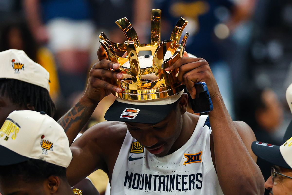 West Virginia Mountaineers G Jasper Floyd (1) places the 2026 College Basketball Crown Championship trophy on his head after defeating the Oklahoma Sooners on Sunday, April 5, 2026, in Las Vegas, Nevada. West Virginia Mountaineers G Jasper Floyd (1) places the 2026 College Basketball Crown Championship trophy on his head after defeating the Oklahoma Sooners on Sunday, April 5, 2026, in Las Vegas, Nevada.