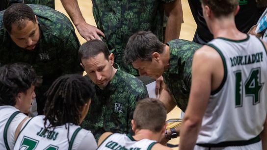 A look inside the Hawai’i huddle during a timeout as associate head coach Brad Davidson draws up a play. A look inside the Hawai’i huddle during a timeout as associate head coach Brad Davidson draws up a play.