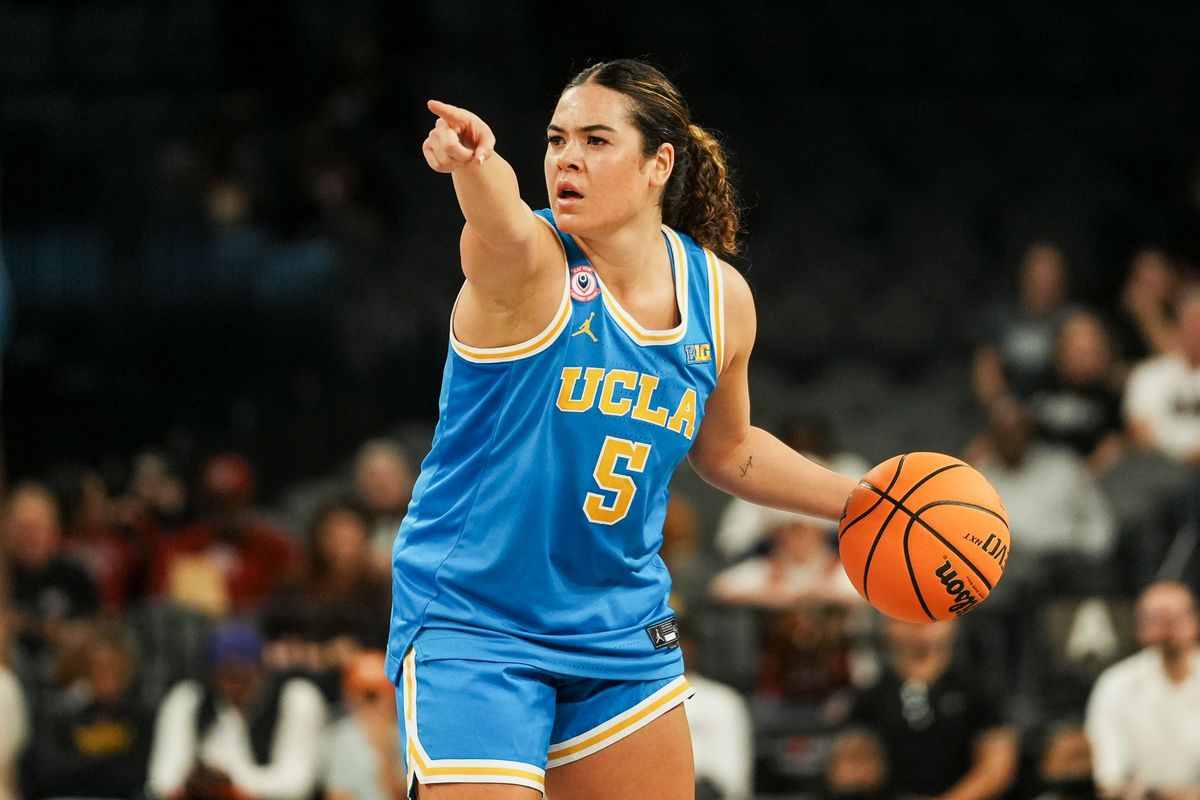 UCLA guard Charisse Leger-Walker (5) motions to her teammates during second half of college basketball game against Texas on Wednesday, Nov. 26, 2025 during the Players Era tournament at Michelob Ultra Arena in Las Vegas.
