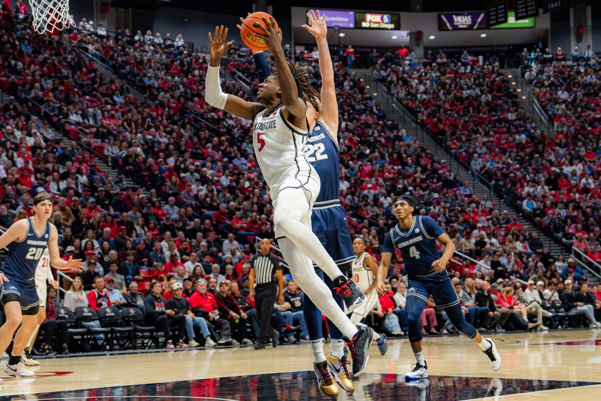 Freshman Forward Pharaoh Compton #5 going straight to the basket in a conference game against Utah State on December 28, 2024 in San Diego, CA Freshman Forward Pharaoh Compton #5 going straight to the basket in a conference game against Utah State on December 28, 2024 in San Diego, CA