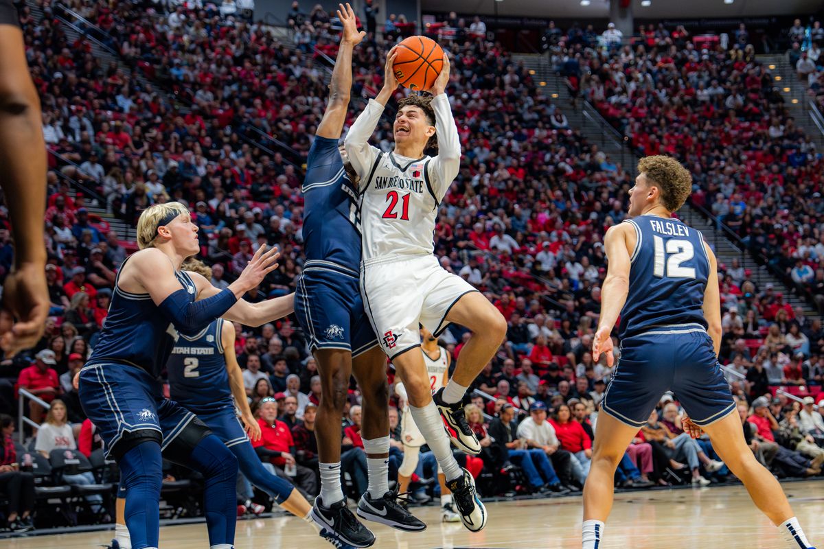 Sophomore Guard Miles Byrd #21 shooting the ball against Utah State on December 28, 2024 in San Diego, CA Sophomore Guard Miles Byrd #21 shooting the ball against Utah State on December 28, 2024 in San Diego, CA