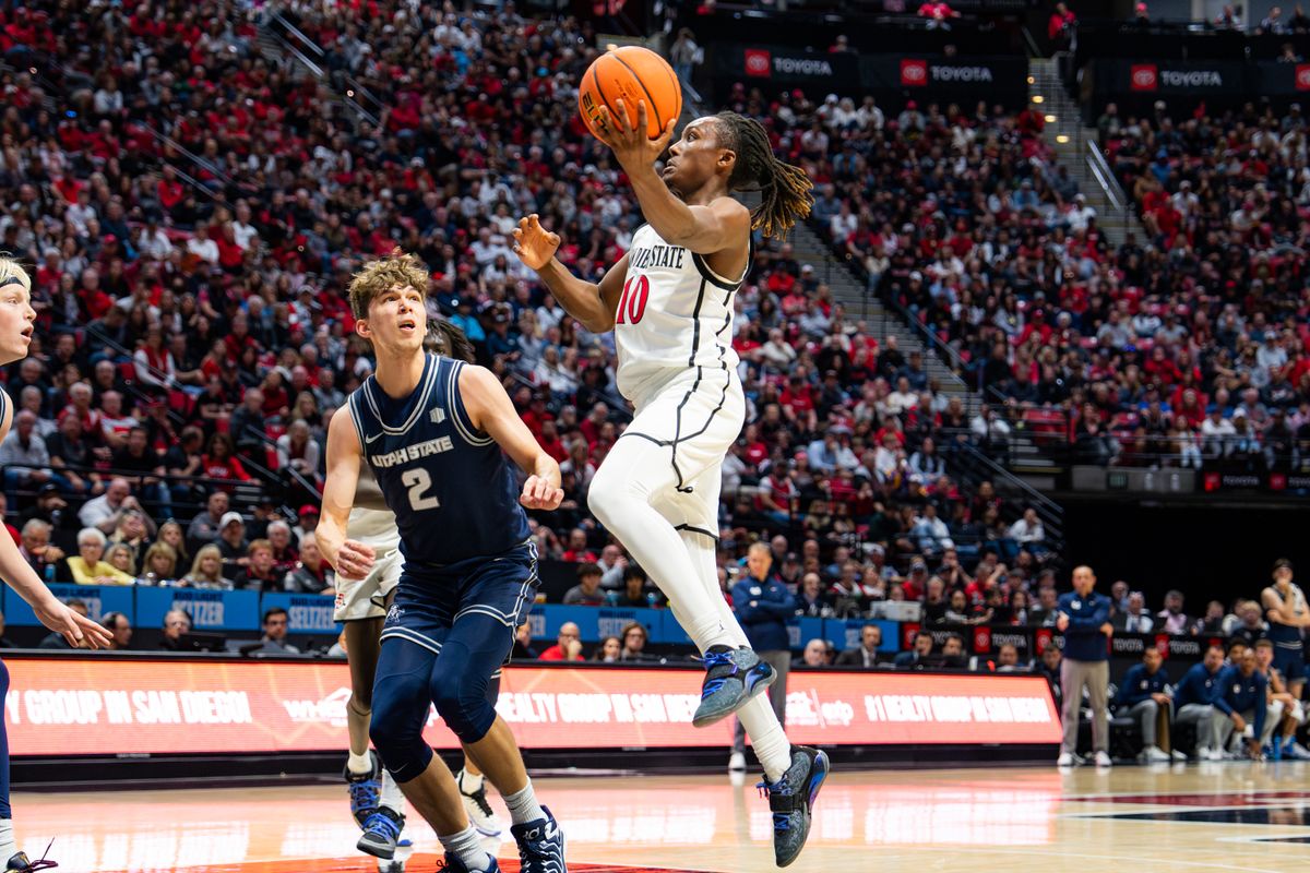 Sophomore Guard BJ Davis #10 driving to the basket against Utah State on December 28, 2024 in San Diego, CA Sophomore Guard BJ Davis #10 driving to the basket against Utah State on December 28, 2024 in San Diego, CA