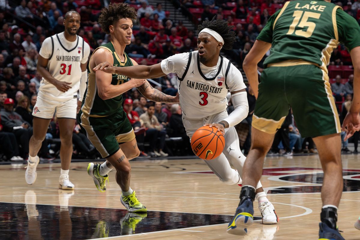 Senior guard Wayne McKinney III (3) dribbles into the lane during a conference matchup against Colorado State, Tuesday, January 14, 2025, in San Diego, CA. Senior guard Wayne McKinney III (3) dribbles into the lane during a conference matchup against Colorado State, Tuesday, January 14, 2025, in San Diego, CA.