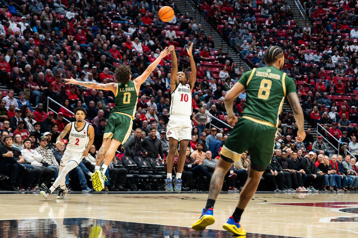 Senior guard Wayne McKinney III (3) shoots a three-pointer during a conference matchup against Colorado State, Tuesday, January 14, 2025, in San Diego, CA. Senior guard Wayne McKinney III (3) shoots a three-pointer during a conference matchup against Colorado State, Tuesday, January 14, 2025, in San Diego, CA.