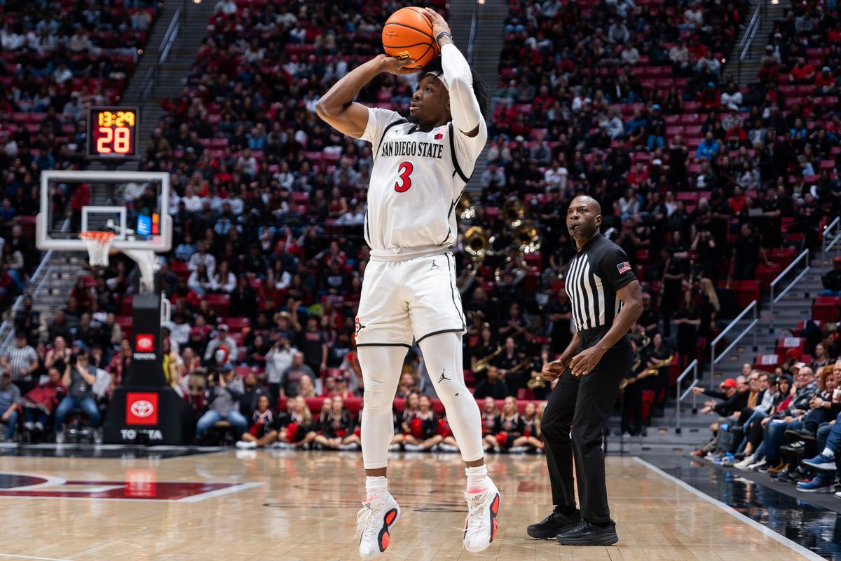 Senior guard Wayne McKinney III (3) shoots a three-pointer during a conference matchup against Colorado State, Tuesday, January 14, 2025, in San Diego, CA. Senior guard Wayne McKinney III (3) shoots a three-pointer during a conference matchup against Colorado State, Tuesday, January 14, 2025, in San Diego, CA.