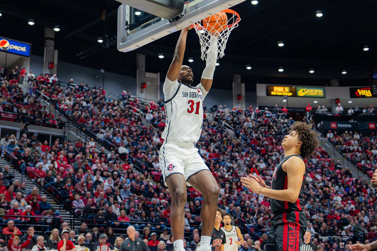 Senior Forward Jared Coleman-Jones #31 dunking in a conference game against UNLV at Viejas Arena in San Diego, CA on January 18, 2025