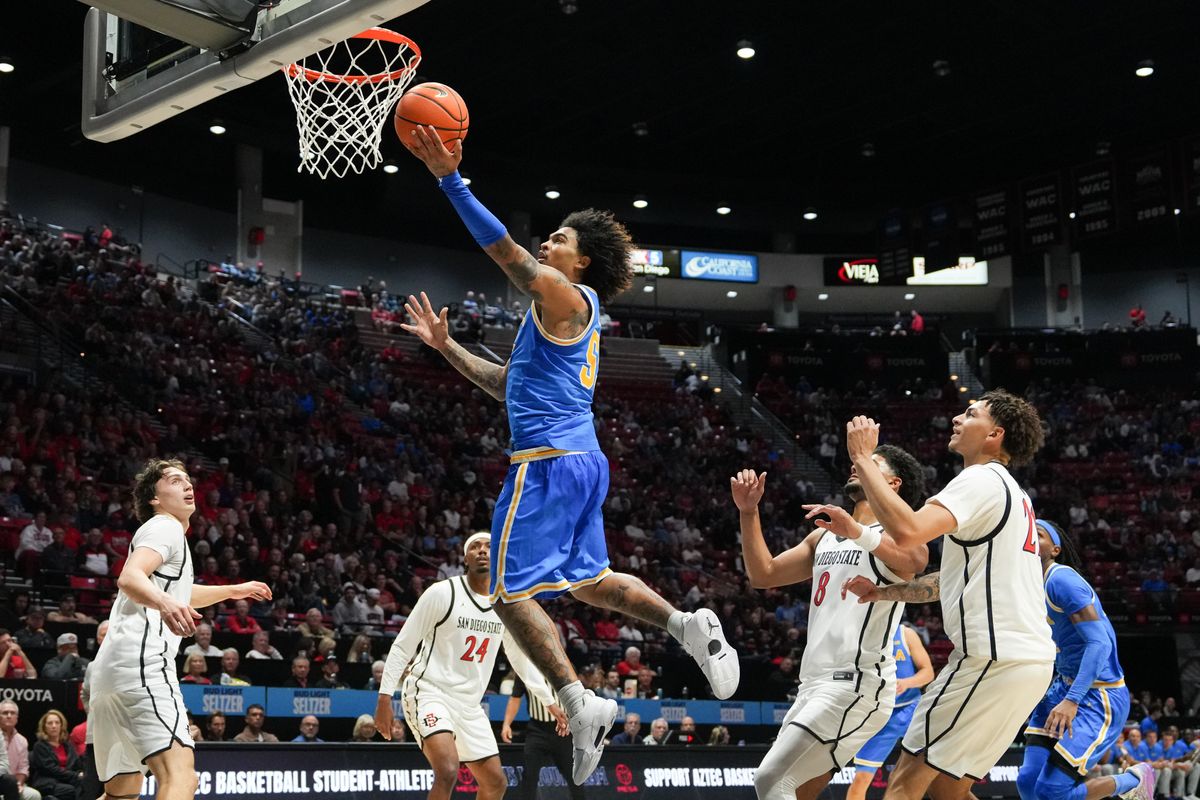 UCLA guard Skyy Clark (55) goes up for a layup during an NCAA basketball game against SDSU, Friday October 17, 2025 in San Diego, California.