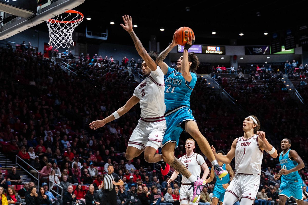 San Diego State guard Miles Byrd (21) attempts a layup during an NCAA Basketball game against Troy, Tuesday November 18, 2025 at Viejas Arena in San Diego, Calif. San Diego State guard Miles Byrd (21) attempts a layup during an NCAA Basketball game against Troy, Tuesday November 18, 2025 at Viejas Arena in San Diego, Calif.