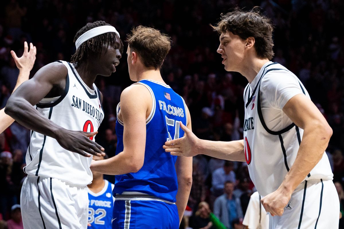 San Diego State forward Magoon Gwath (0) high fives guard Sean Newman Jr. (4) an NCAA Basketball game between Air Force and San Diego State, Wednesday December 17, 2025 at Viejas Arena in San Diego, Calif.