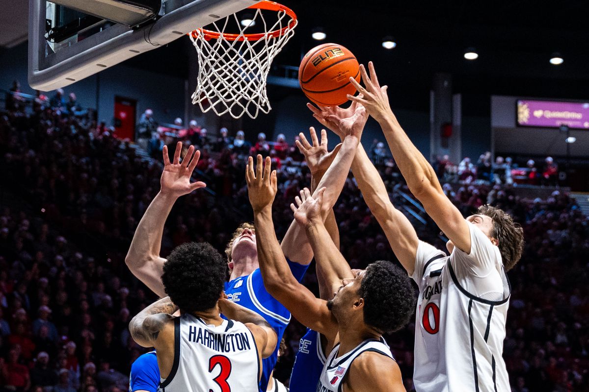 Players fight for the ball during an NCAA Basketball game between Air Force and San Diego State, Wednesday December 17, 2025 at Viejas Arena in San Diego, Calif.