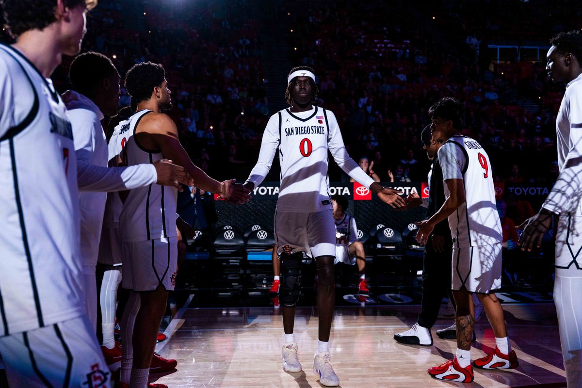 San Diego State forward Magoon Gwath (0) is introduced before an NCAA Basketball game between Whittier and San Diego State, Monday December 22, 2025 at Viejas Arena in San Diego, Calif.