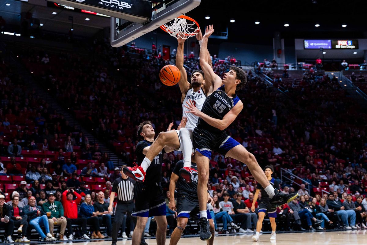 San Diego State forward Tae Simmons (8) dunks during an NCAA Basketball game between Whittier and San Diego State, Monday December 22, 2025 at Viejas Arena in San Diego, Calif.