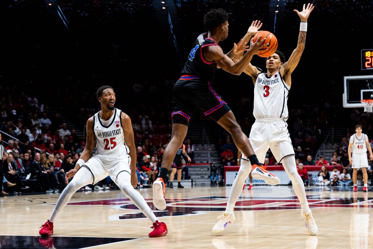 San Diego State guard Elzie Harrington (3) and forward Jeremiah Oden (25) guard Boise State guard Dylan Andrews (4) during an NCAA Basketball game between Boise State and San Diego State, Saturday January 3, 2026 at Viejas Arena in San Diego, Calif.