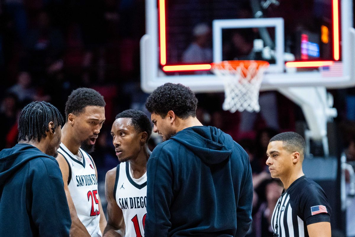 San Diego State guard BJ Davis (10) stands with teammates after making a buzzer beater to send the game to overtime during an NCAA Basketball game between Boise State and San Diego State, Saturday January 3, 2026 at Viejas Arena in San Diego, Calif.