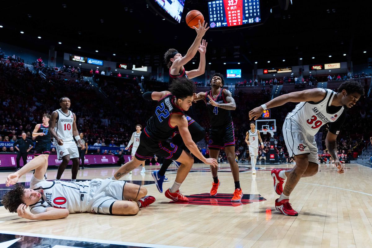 Players fight for the ball during an NCAA Basketball game between Boise State and San Diego State, Saturday January 3, 2026 at Viejas Arena in San Diego, Calif.