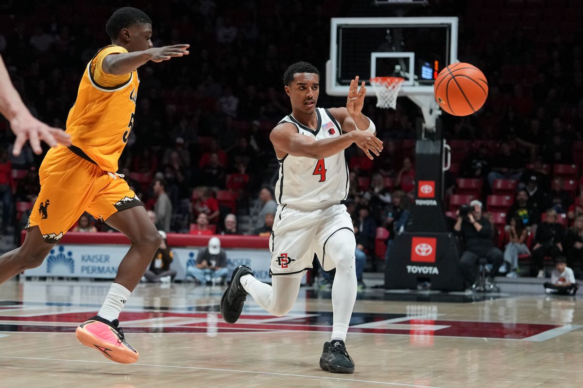 SDSU guard Sean Newman Jr. (4) passes the ball during an NCAA basketball game against Wyoming, Tuesday February 03, 2026 in San Diego, California