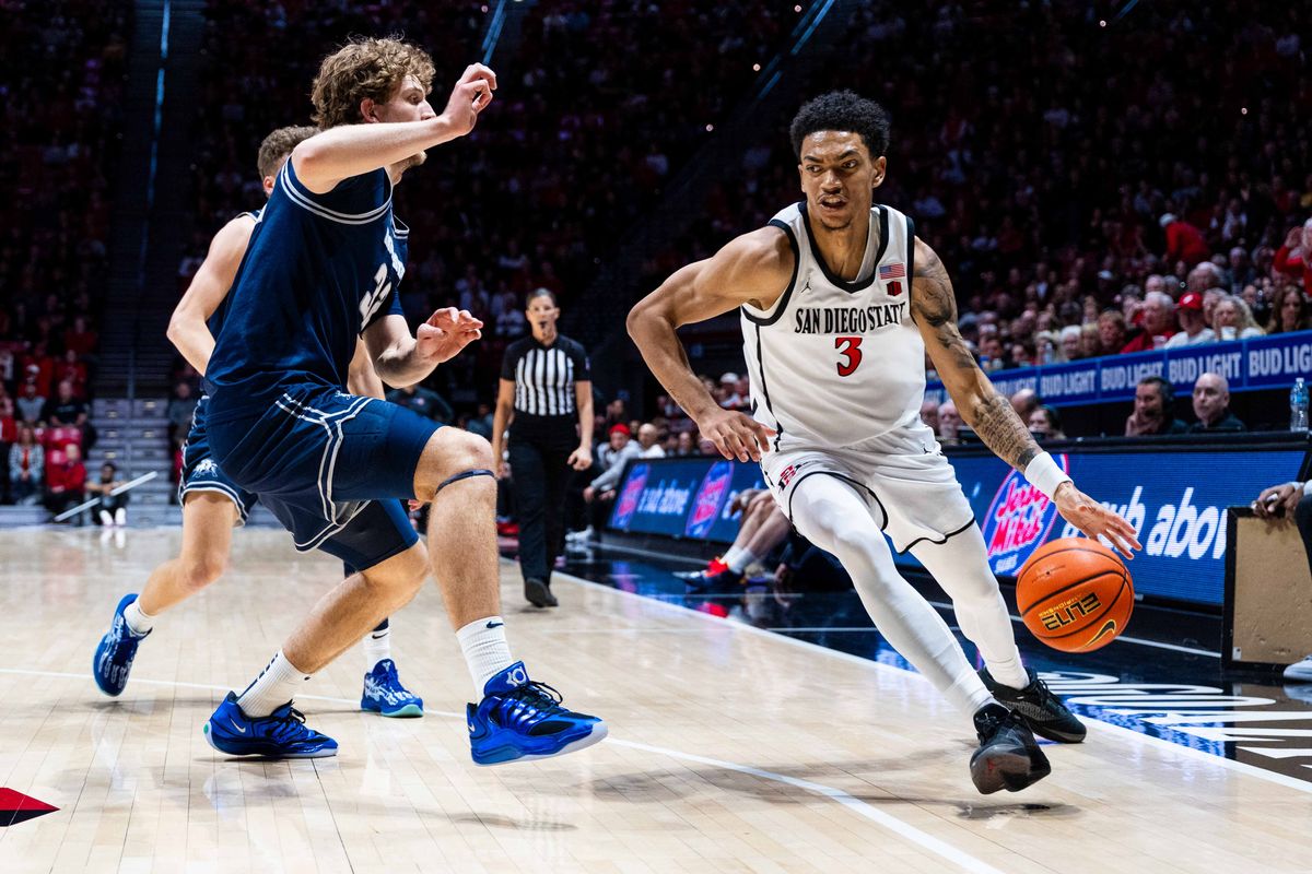 San Diego State guard Elzie Harrington (3) drives during an NCAA Basketball game between Utah State and San Diego State, Wednesday February 25, 2026 at Viejas Arena in San Diego, Calif.