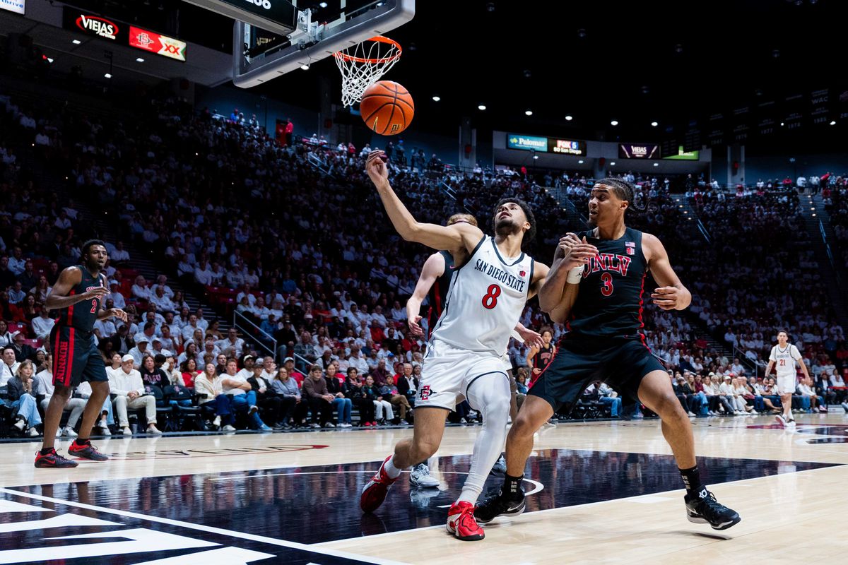 San Diego State forward Tae Simmons (8) tries to save the ball during an NCAA Basketball game between UNLV and San Diego State, Friday March 6, 2026 at Viejas Arena in San Diego, Calif.