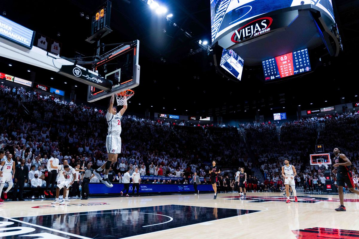 San Diego State guard Miles Byrd (21) dunks after winning an NCAA Basketball game between UNLV and San Diego State, Friday March 6, 2026 at Viejas Arena in San Diego, Calif.