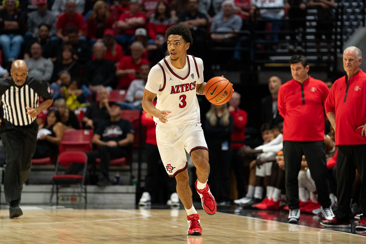 San Diego State Aztecs guard Ezlie Harrington (3) advances the ball during the NCAA men’s basketball game against the University of Southern California Trojans, Friday, Oct. 23, 2026, at Viejas Arena in San Diego.